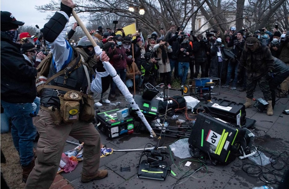 Violent protesters break TV equipment outside the U.S. Capit